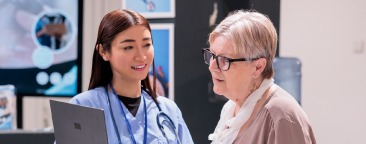 Healthcare worker speaks with patient
