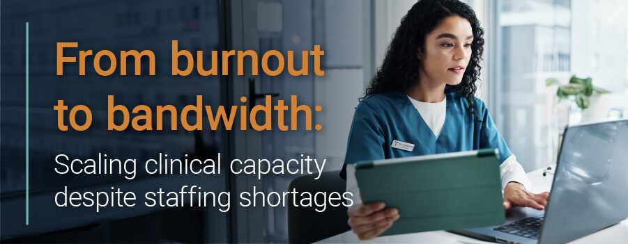 Healthcare worker uses laptop.