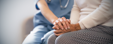 Healthcare worker supports patient